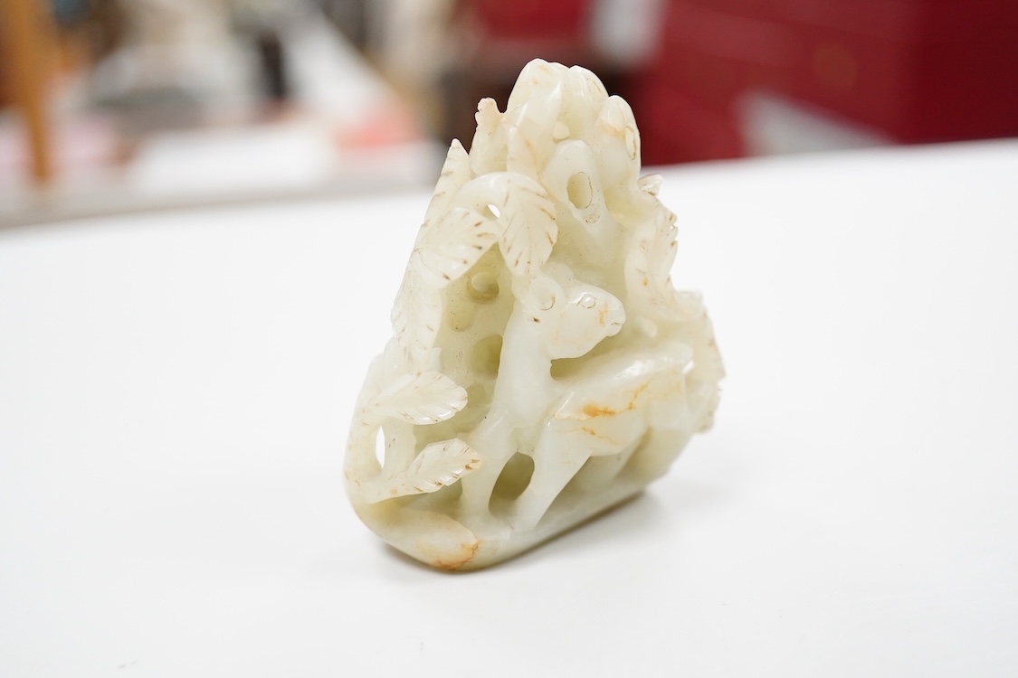 A Chinese pale celadon jade 'deer' pebble carving, 7cm high